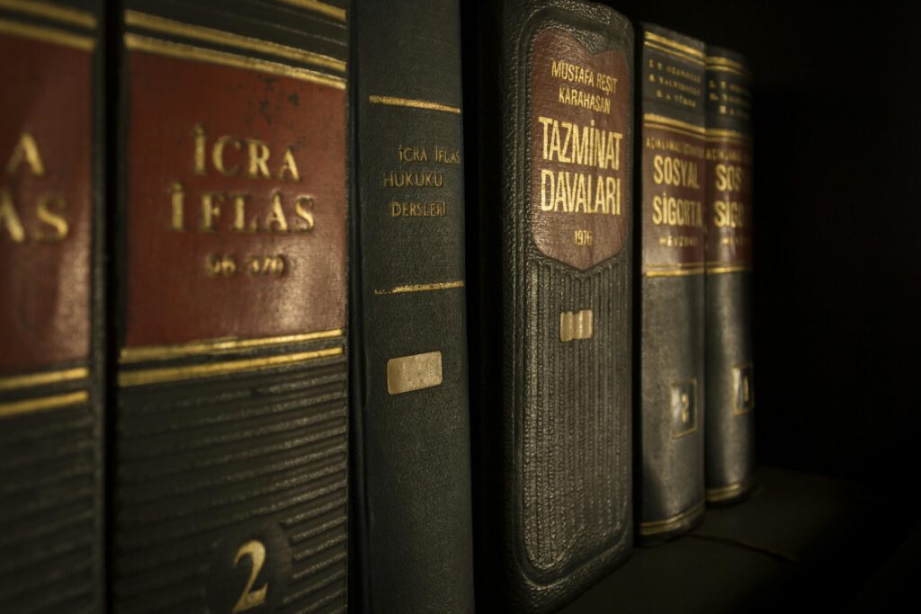 justice law case hearing 159832 159832 Detailed close-up of law and regulation books on a bookshelf, emphasizing education and knowledge.